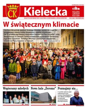 Grafika. Pierwsza strona biuletynu "Kielecka" nr 23. Na dużym zdjęciu duża grupa ludzi pozuje do zdjęcia na ulicy Sienkiewicza. Wśród grupy ludzie w strojach mikołajków. Nad zdjęciem napis: W świątecznym klimacie. Poniżej zapowiedzi trzech tekstów: Wspieramy młodych. Nowa hala "Żeroma", Poznajmy się.