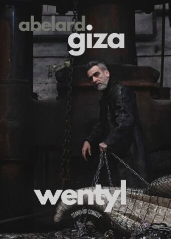 Grafika. Plakat stand-upu. Zdjęcie mężczyzny z ciemną brodą trzymającego łańcuch, do którego przyczepiony jest szary smok. Nad mężczyzną napis: Abelard Giza. Pod mężczyzną napis: Wentyl.